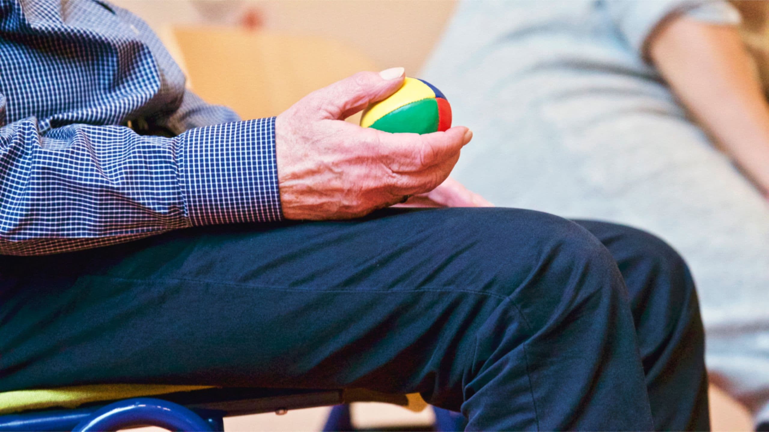 Physiotherapist supporting a stroke patient during rehabilitation