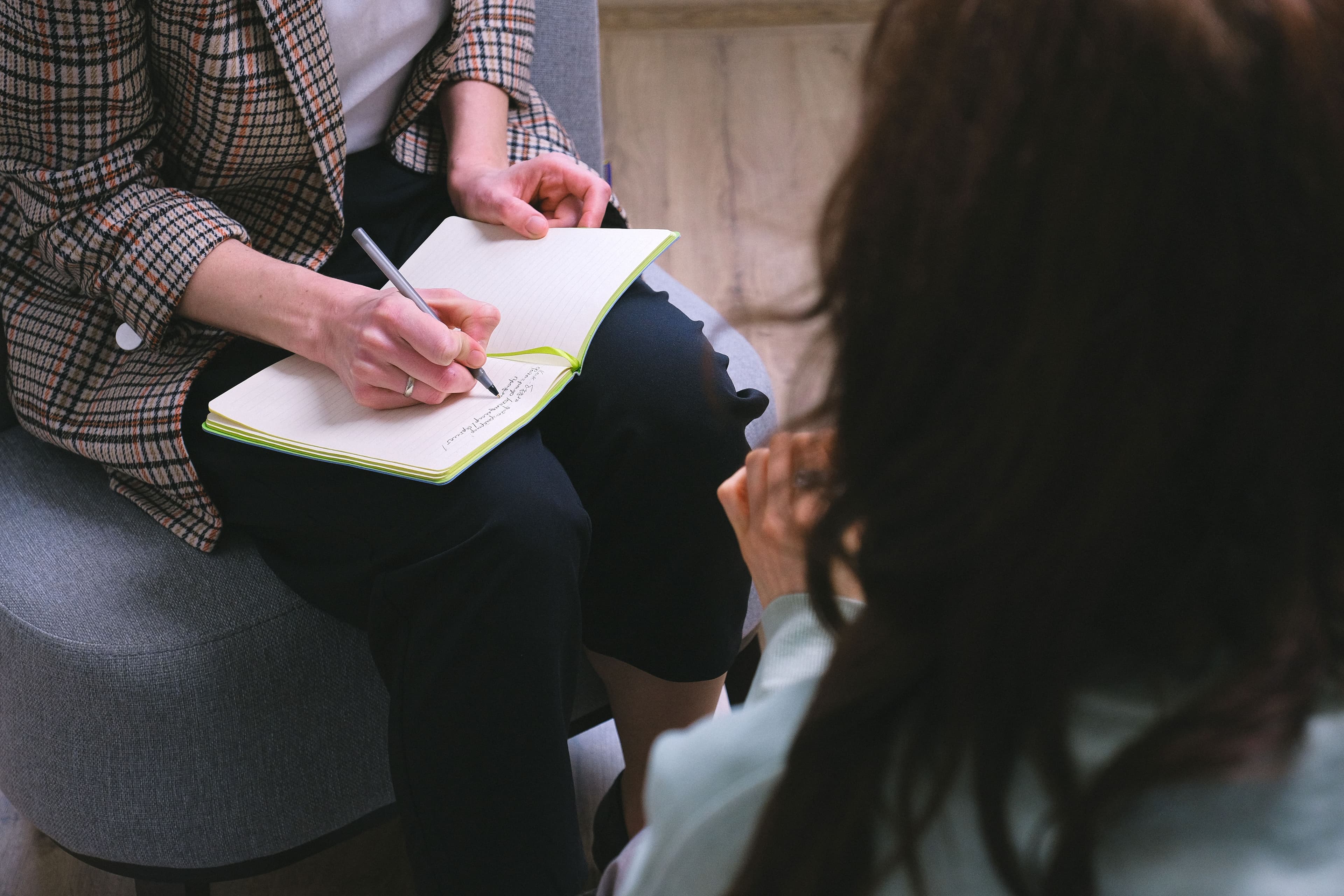 Physiotherapist explaining treatment to a patient